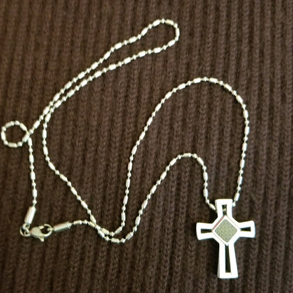 Chisel stainless steel polished cross pendant with a grey carbon fiber inlay